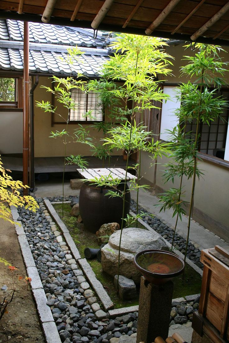 Large Ceramic Vessel and Rocks Create a Zen Garden Focal Point