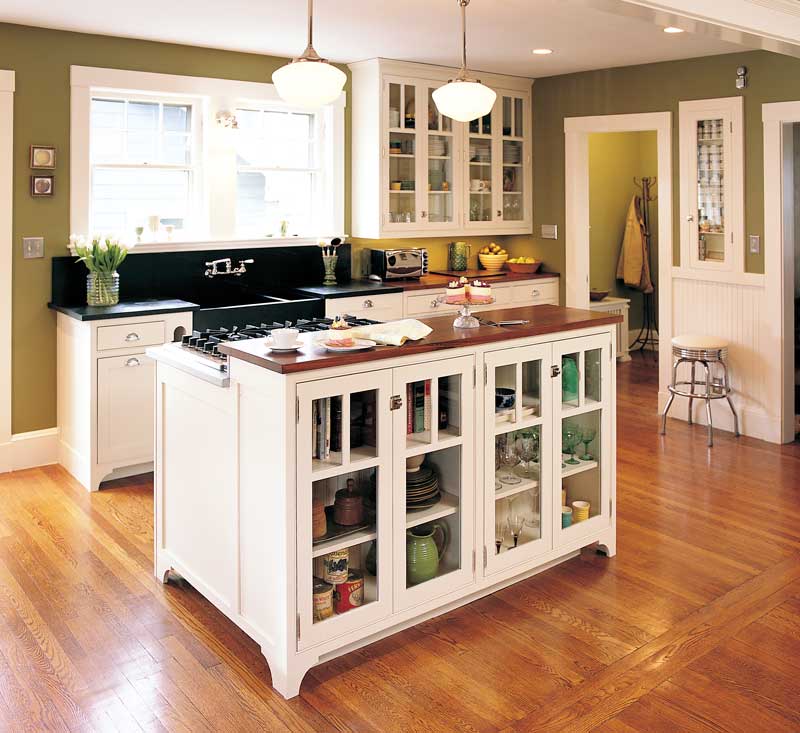 Glass-Fronted Island Cabinets Display Everyday Dishware and Cookbooks