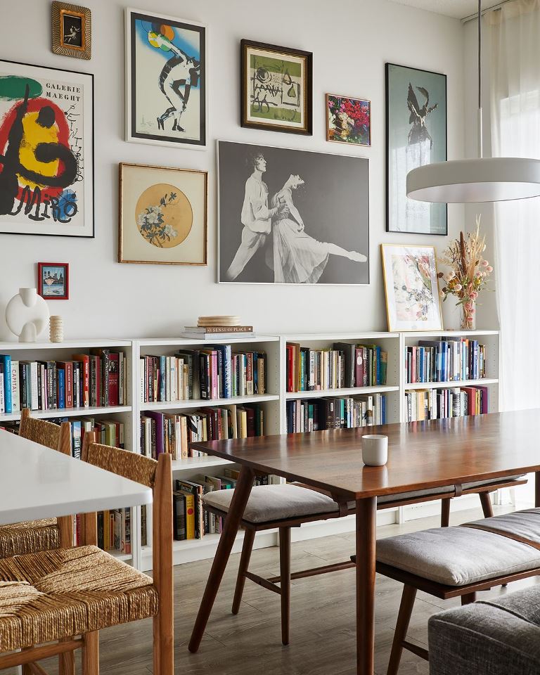 Gallery Wall Above Long White Bookshelves