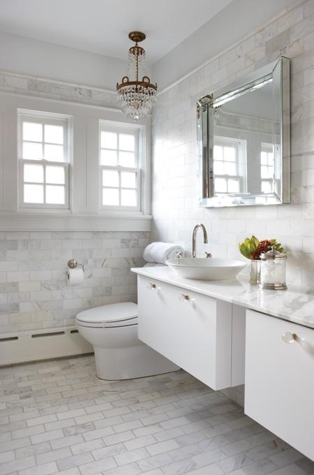 Crystal Chandelier Adds Glamour Above Marble Bathroom