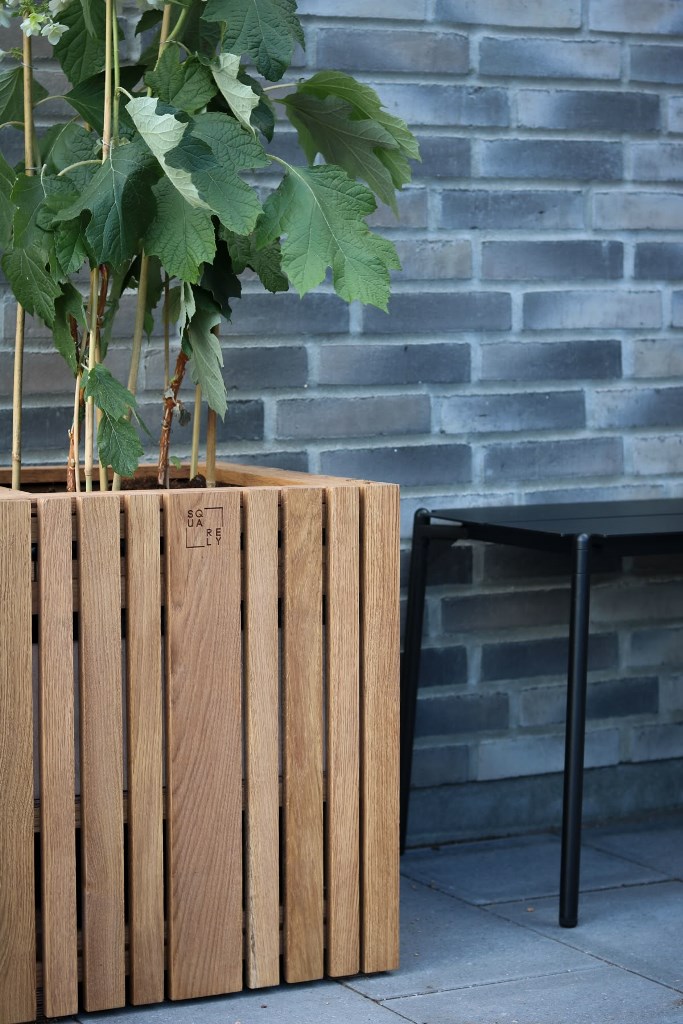 Natural Wood Planter With Subtle Logo Detail