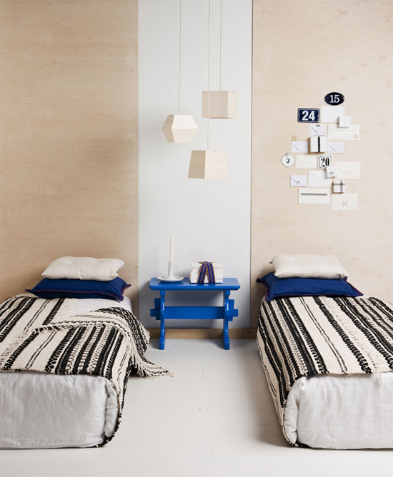 Wooden Geometric Pendants Add Natural Texture Above Beds