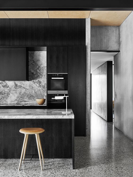 Wooden Stool Adds Natural Contrast to Dark Island