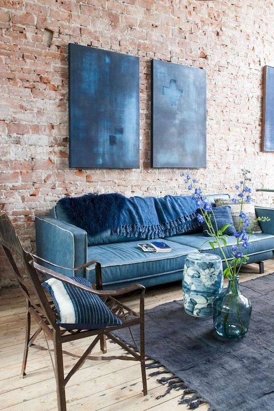 Large Blue Canvases Add Moody Color to Brick Walls