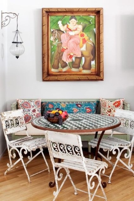 Incorporate Distressed Metal Chairs with a Mosaic Table