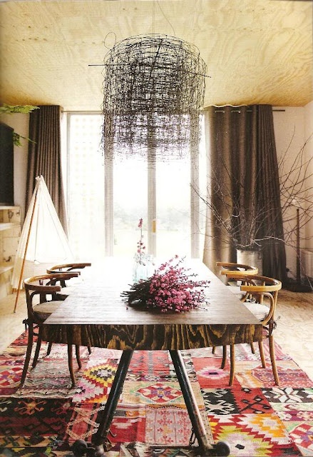 Wire Chandelier Creates a Dramatic Focal Point Above the Table