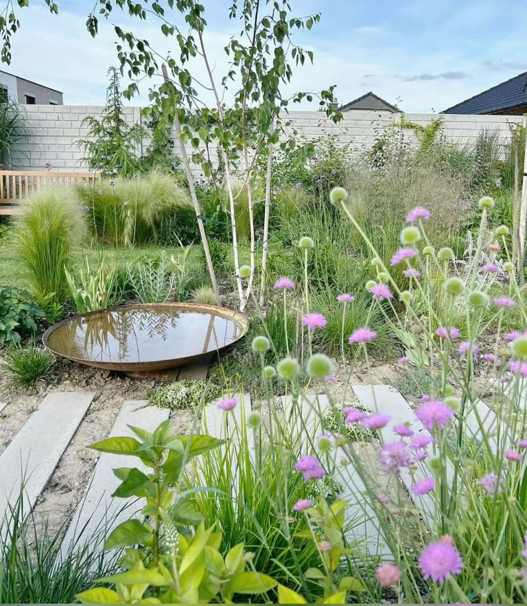 Wide, Flat Bird Bath Creates a Reflective Garden Feature