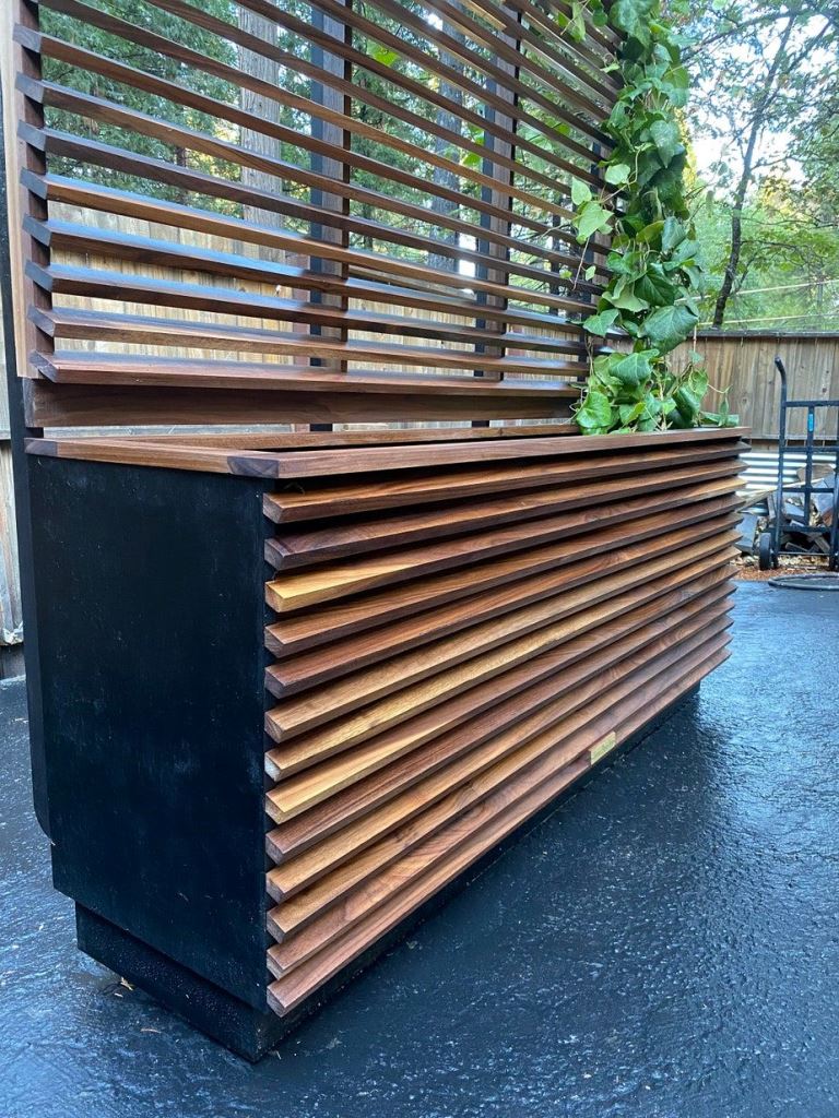 Slatted Planter With Black Base Creates Modern Contrast