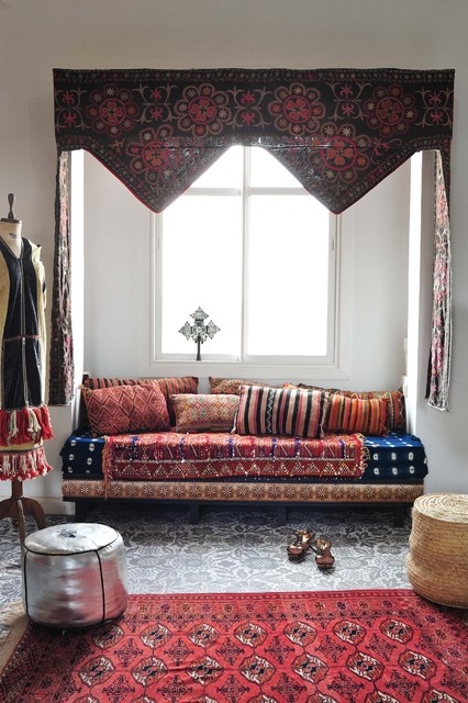 Ornate Valance Frames Window Above Patterned Daybed