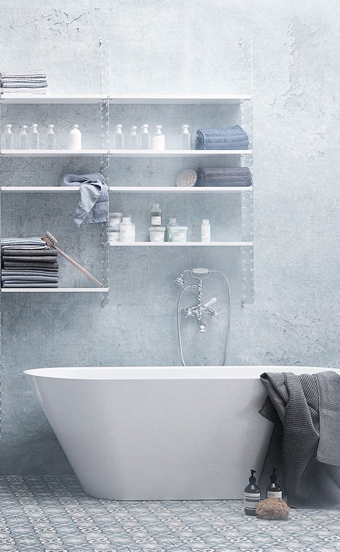 White Shelving Unit Organizes Bathroom Essentials Neatly
