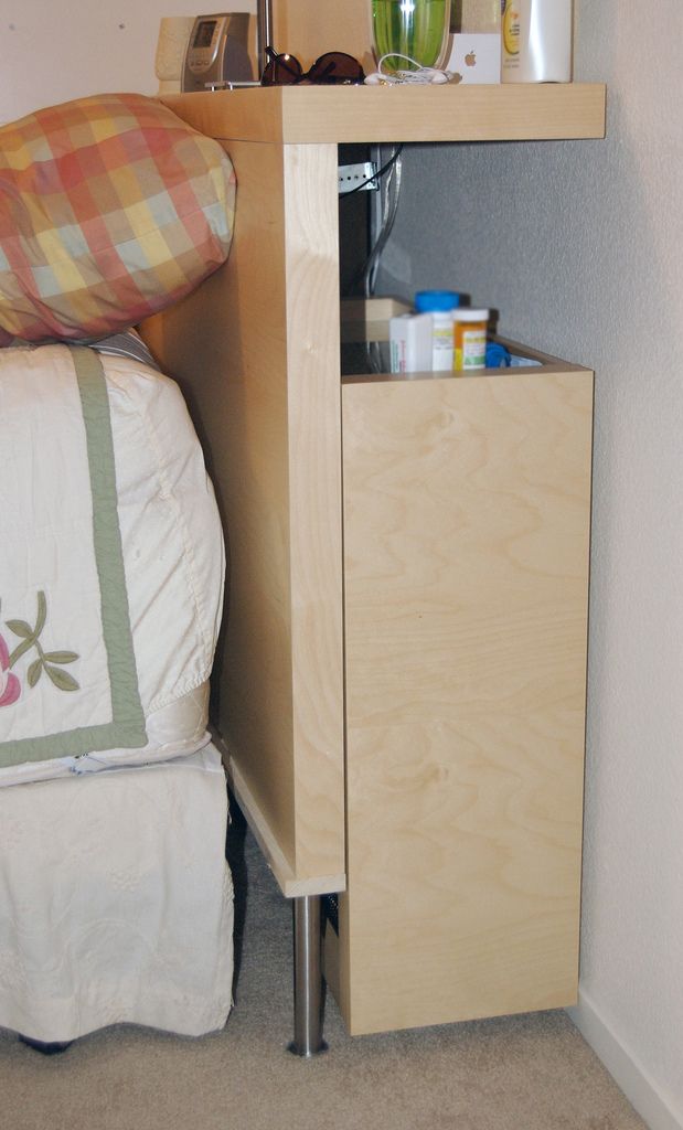 Light Wood Headboard With Integrated Drawer and Open Shelf
