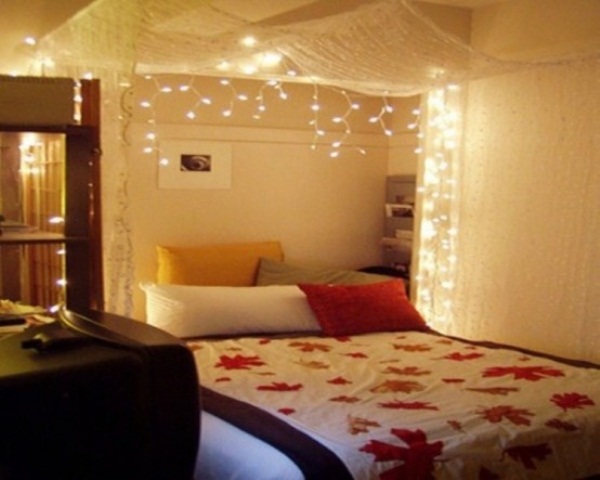 Netting Canopy With Cascading Lights Creates a Dreamy Bedside Glow