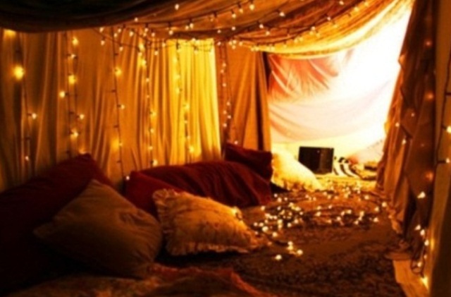 Draped Fabric Creates a Cozy Fort Lit by String Lights