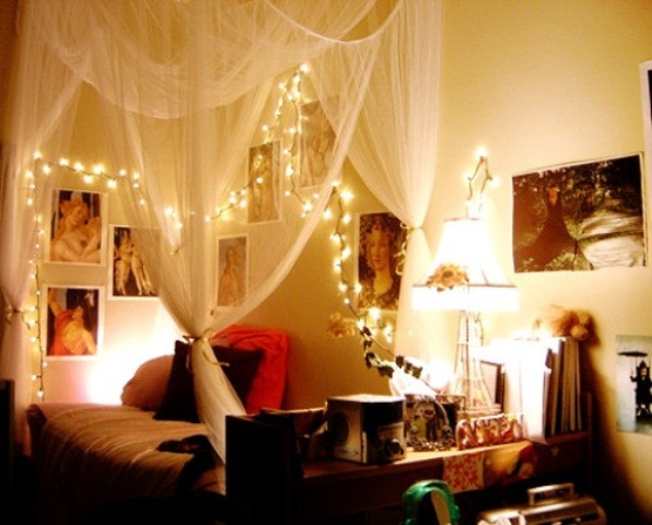 Frame Artwork Above the Bed with Draped Canopy Lights
