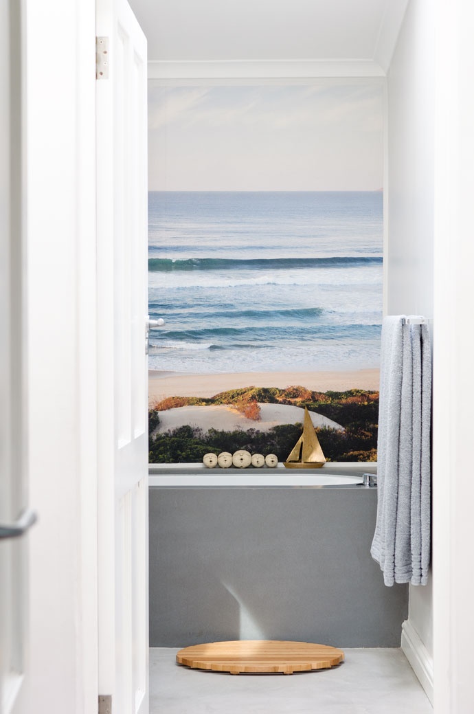 Golden Sailboat Adds Nautical Charm to Bath Shelf Display
