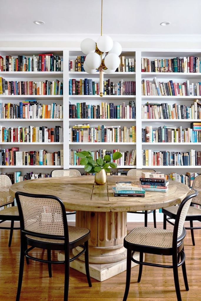 Cane and Black Chairs Pair With a Reclaimed Wood Dining Table