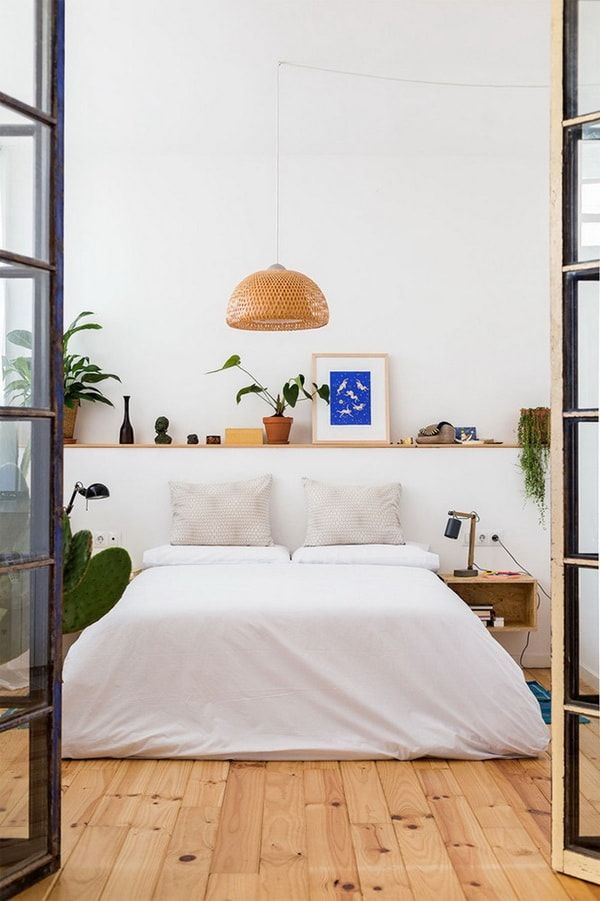 Long Floating Shelf Displays Plants and Art Above Your Bed