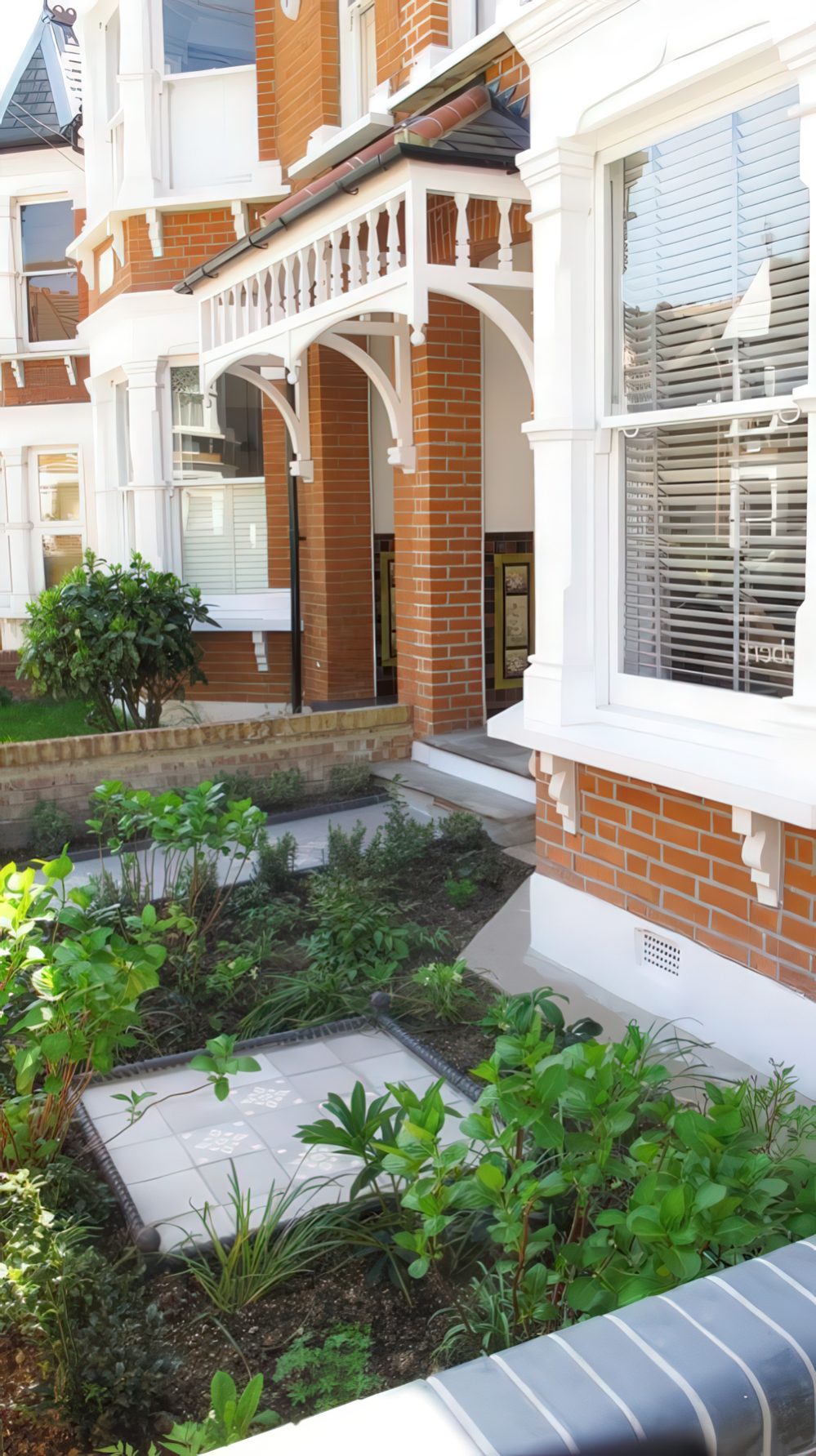 Square White Tile Inserts Add Pattern to Garden Beds