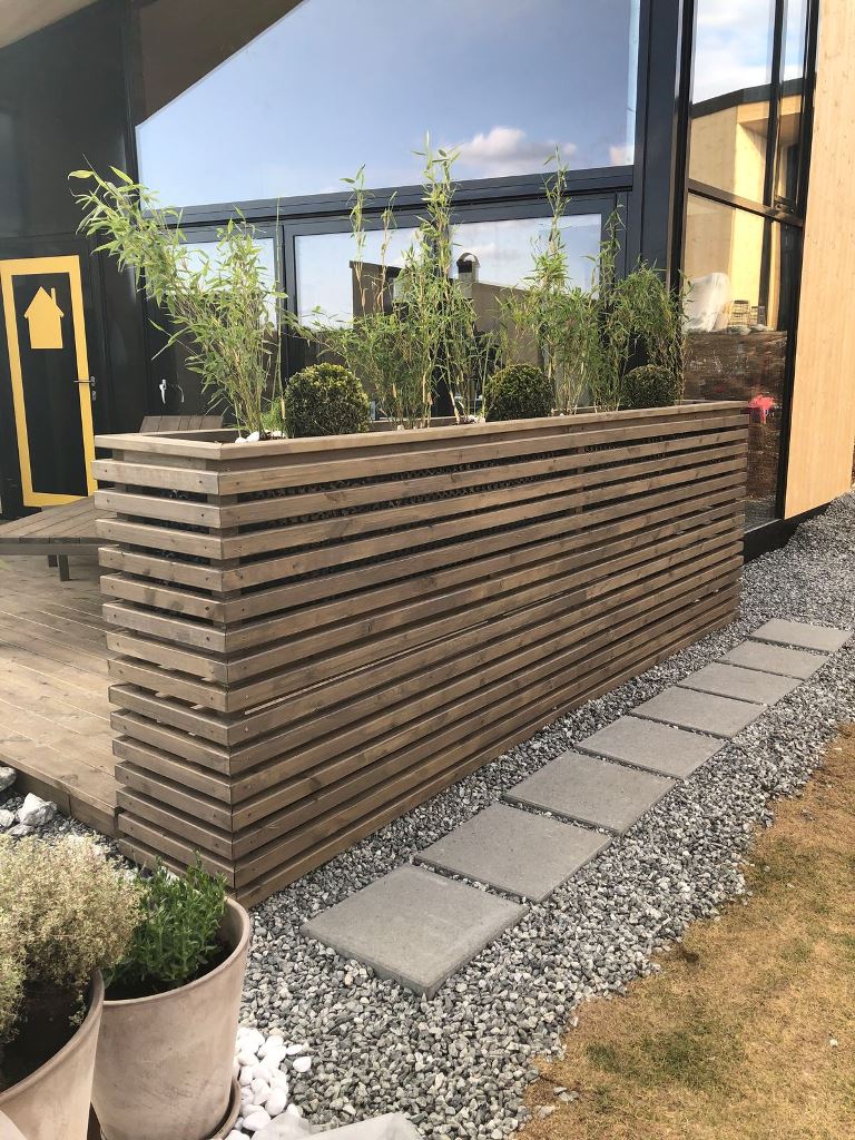 Wide Wooden Planter Creates a Natural Privacy Screen