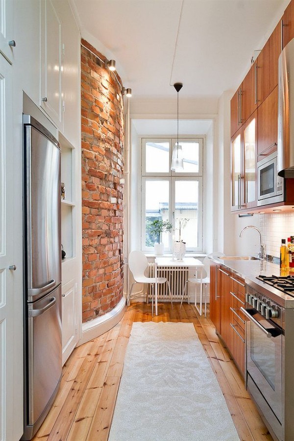 Exposed Brick Wall Adds Industrial Texture to Narrow Kitchen