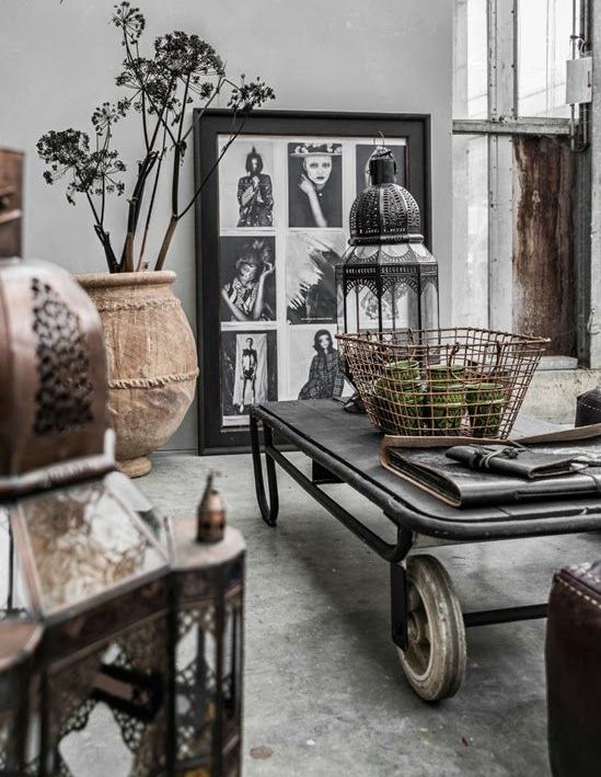 Gallery Wall of Portraits Adds Dramatic Flair Above Low Table