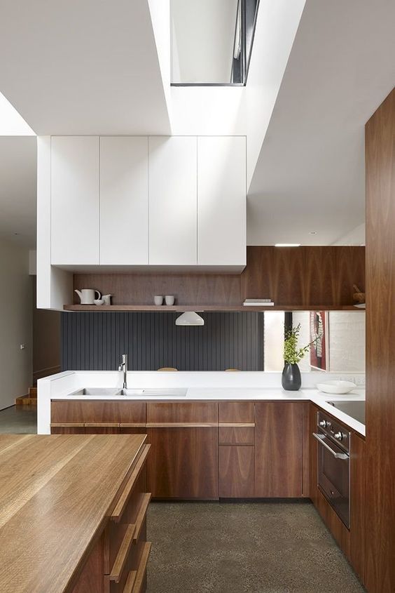 Streamline Your Look with Dark Wood Cabinets and Integrated Pulls