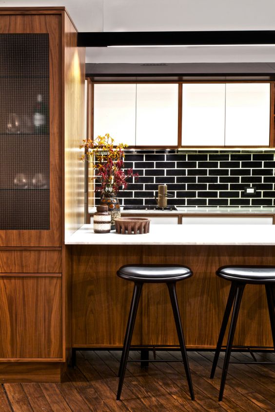 Dark Wood Cabinetry With Mesh Glass Door