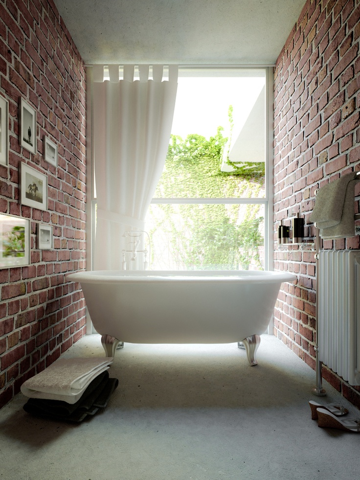 Stack Towels Beside a Freestanding Tub for Easy Access
