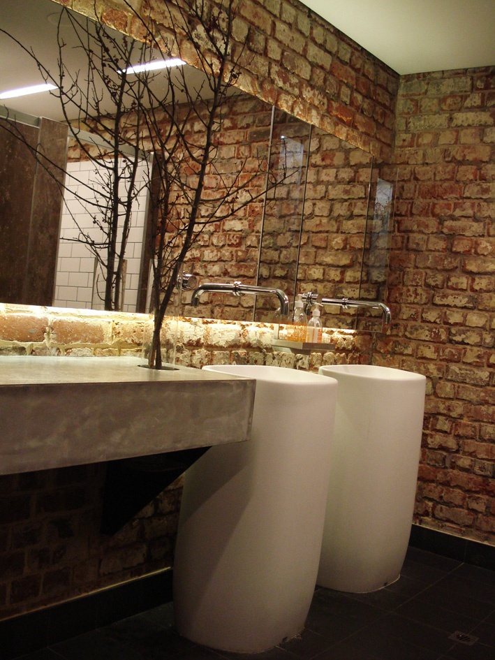 Bare Branches Add Organic Sculpture to Concrete Vanity
