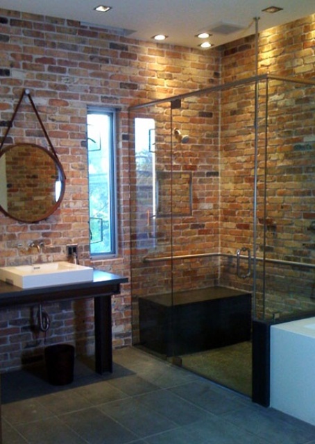 Include a Dark Bench for Seating Inside a Glass Shower