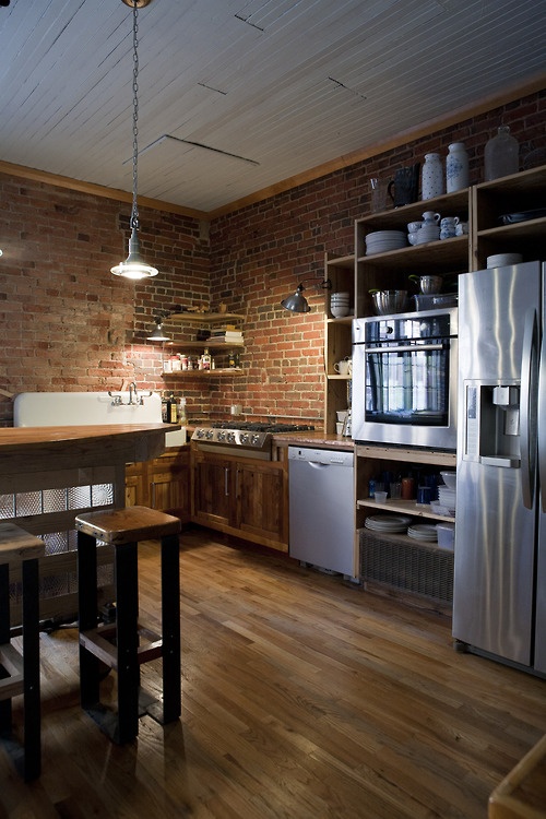 Open Shelving With Rustic Ceramic Jars and Plates