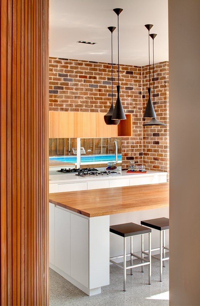 Black Cone Pendant Lights Over Island