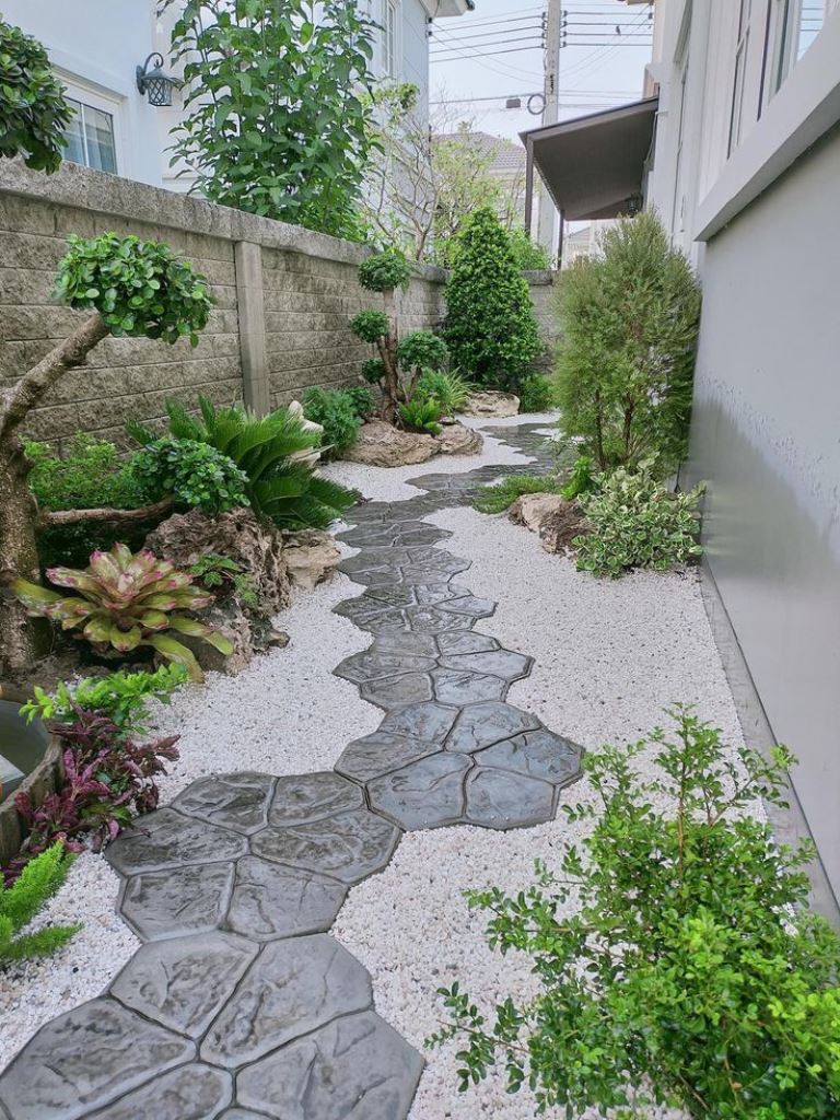 Irregular Stone Pavers Define a Winding Path Through White Gravel