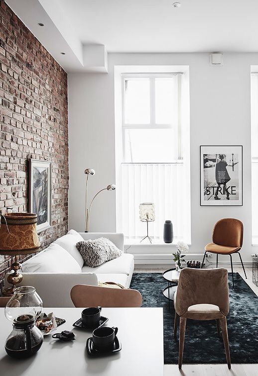 Tall Floor Lamp Arches Over a Sofa