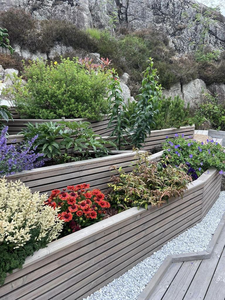 Tiered Wooden Planters That Follow a Sloping Yard
