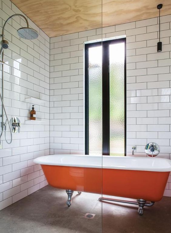 Orange Clawfoot Tub Adds a Bold Pop of Color