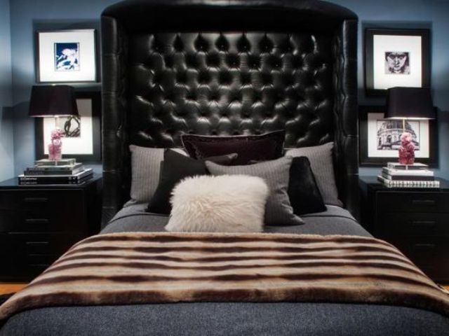 Tall Tufted Black Headboard Creates a Dramatic Canopy