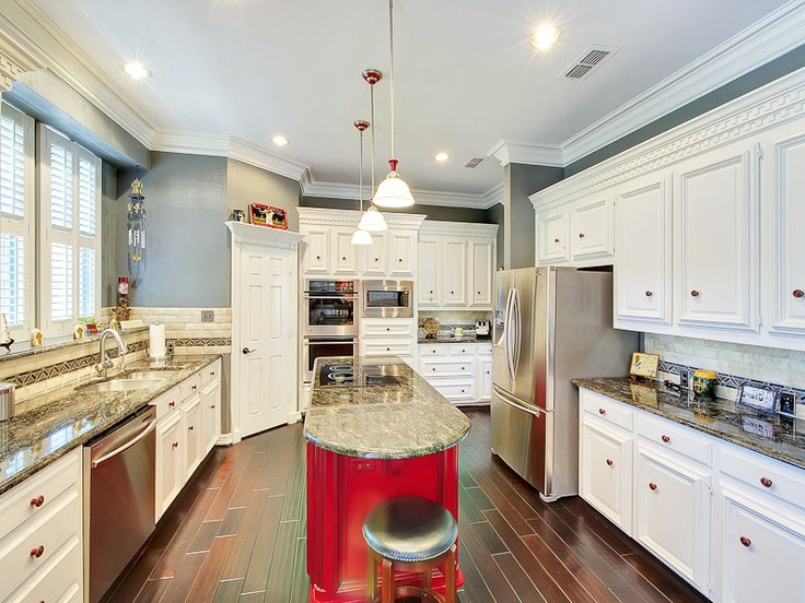 Bold Red Island Base Anchors Your Kitchen Design
